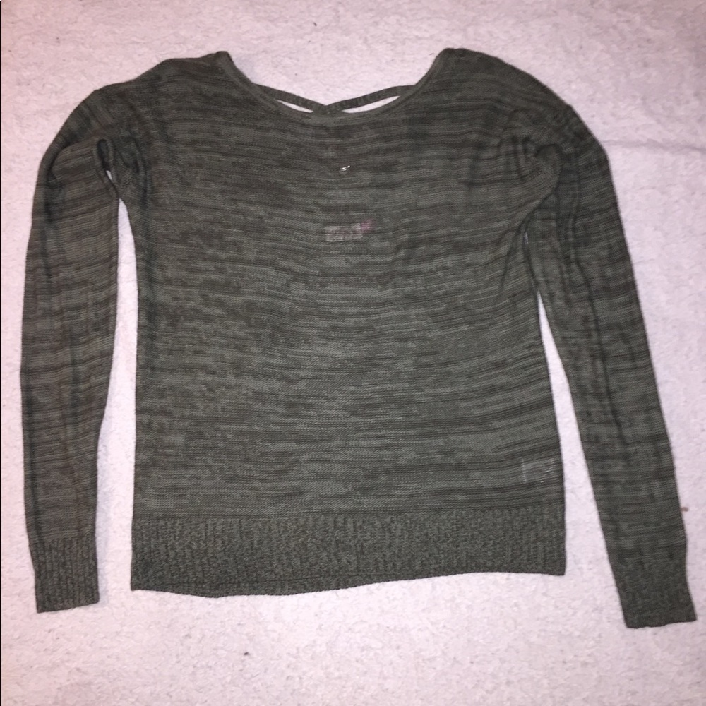 Olive green sweater with a cross back design